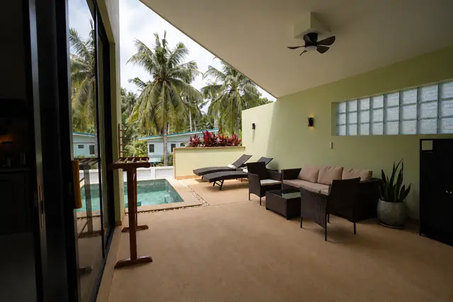 Tropical veranda with pool and palms