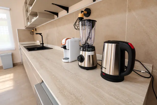 Modern beige kitchen with appliances