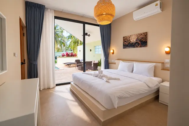 Tropical bedroom with pool view