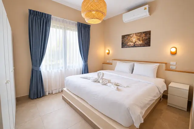 Cozy bedroom with towel swans