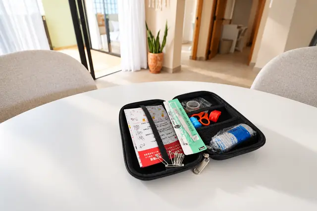 Sewing and first aid kit on dining table