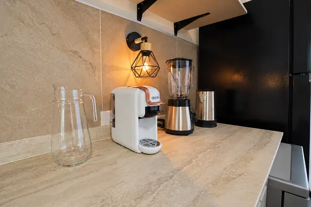 Kitchen counter with coffee machine and lamp