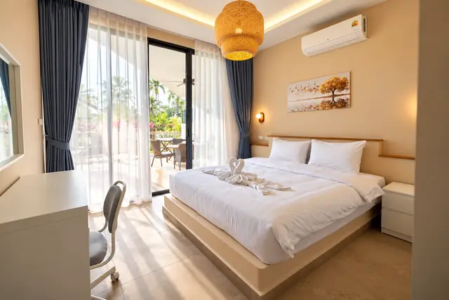 Bedroom with desk and terrace door