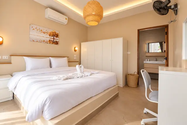 Bedroom with wardrobe and bathroom view