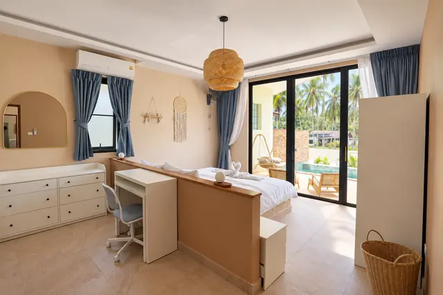 Bright tropical bedroom with pool view