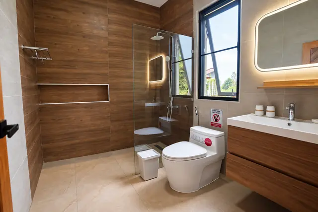 Modern bathroom with wood panels and shower